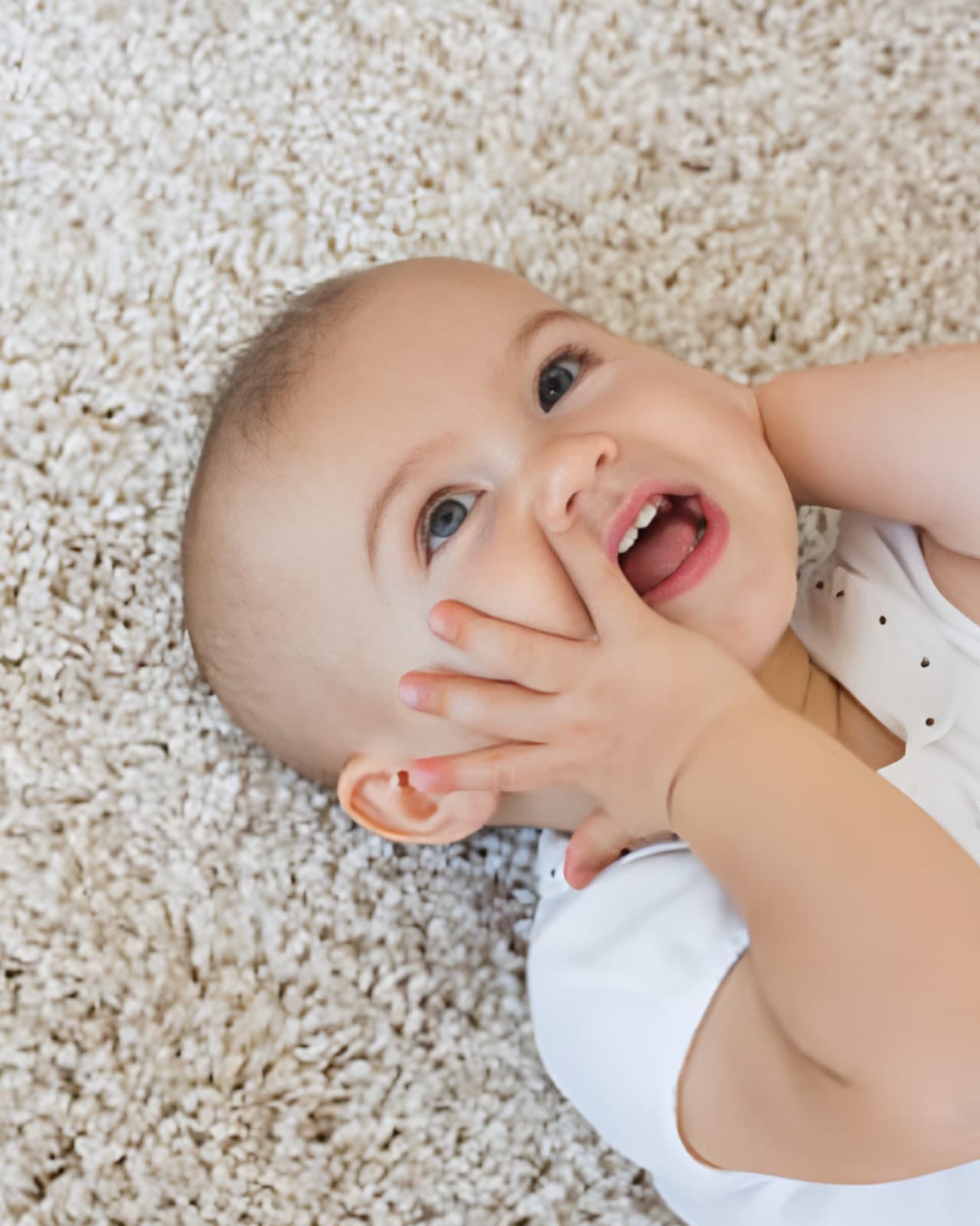 Baby's bare feet on a soft, freshly cleaned rug in a Cypress home